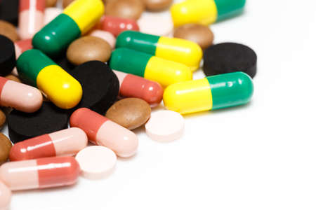 Various pills and capsules on white backgroundの写真素材