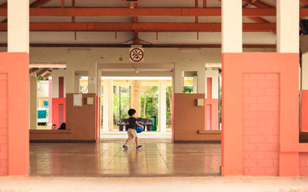 Singapore - 05 OCT 2019: child play in HDB function room open spaceのeditorial素材