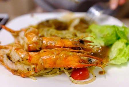 shrimp and vegetable seafood pasta closeup viewの写真素材