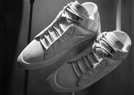 white color fashion shoes display on the wallの写真素材