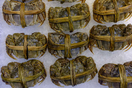 raw crab display on sale in supermarket