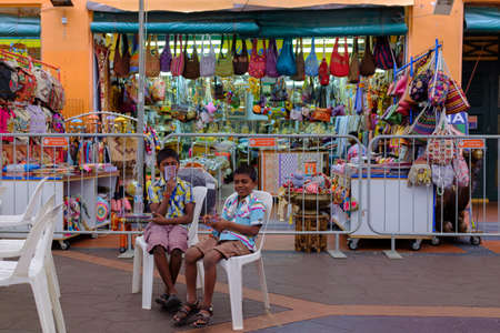 Singapore-09 DEC 2017:Indian children sitting in front of shopのeditorial素材