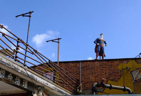 jiangxi,nanchang-05 SEP 2019: super man sculpture stand on the factory roof in 699 art parkのeditorial素材
