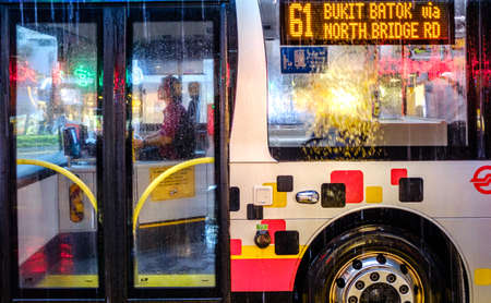 Singapore-29 JAN 2020:Singapore public bus in bus stop in rain dayの写真素材
