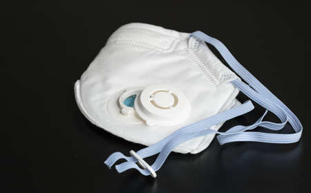 The N95 mask, placed on black background.の写真素材