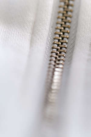 locked white metal zipper closeup detail viewの写真素材