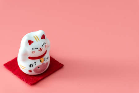 ceramics happy cat figure on pure color backgroundの写真素材