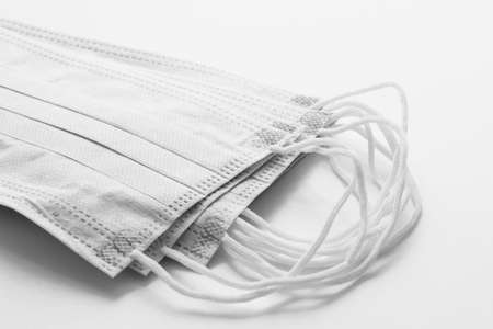 medical surgical flu illness protective mask textile filter on white backgroundの写真素材