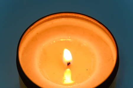 One candle flame at night closeup viewの写真素材