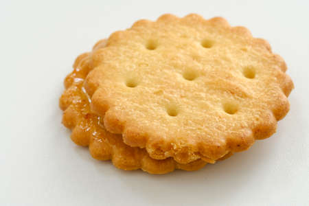 Stack of sweetmeal digestive biscuits isolated on whiteの写真素材