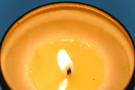 One candle flame at night closeup viewの写真素材