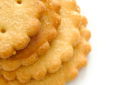 Stack of sweetmeal digestive biscuits isolated on whiteの写真素材