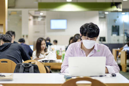 Singapore-19 FEB 2020: student wear mask study in Study roomのeditorial素材