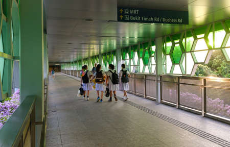 Singapore-07 FEB 2020: school girl walk on the shelter corridorのeditorial素材