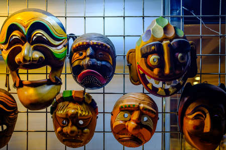 wood cute masks display at net wallの写真素材