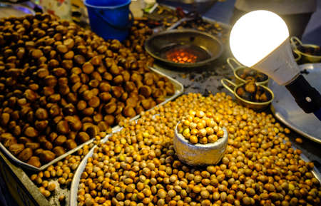Chestnuts roasted for sale in a night marketの写真素材