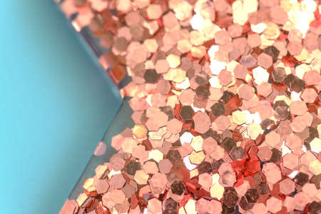 pink Christmas star isolated on blue backgroundの写真素材