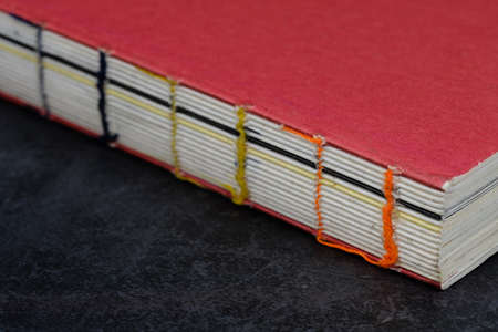 vintage style wire-bound book closeup viewの写真素材