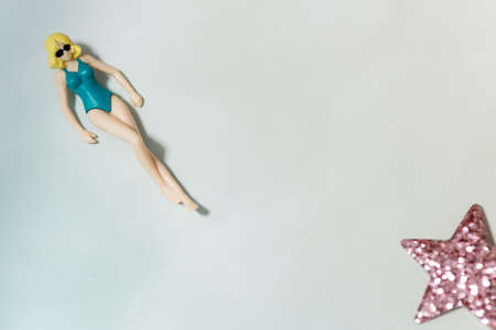 swimsuit Women plastic toy top view on blue backgroundの写真素材
