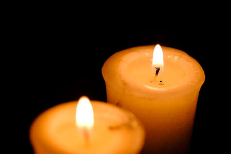 One candle flame at night closeup viewの写真素材