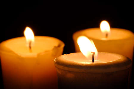One candle flame at night closeup viewの写真素材