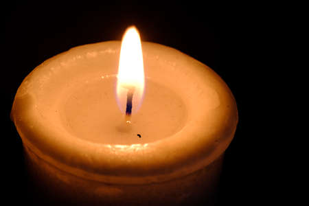 One candle flame at night closeup viewの写真素材