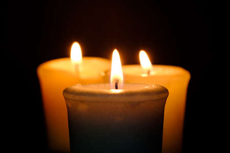 One candle flame at night closeup viewの写真素材