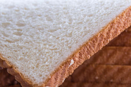 White bread slices closeup macro view backgroundの写真素材