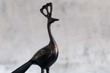 black color metal Peacock sculpture on white backgroundの写真素材