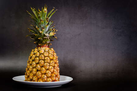 Pineapple on a black background with copy spaceの写真素材