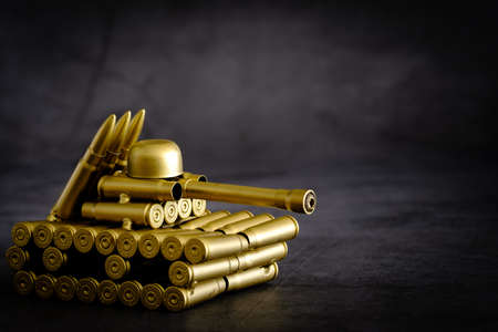 bullet shell toy tank on a black backgroundの写真素材