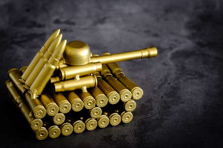 bullet shell toy tank on a black backgroundの写真素材