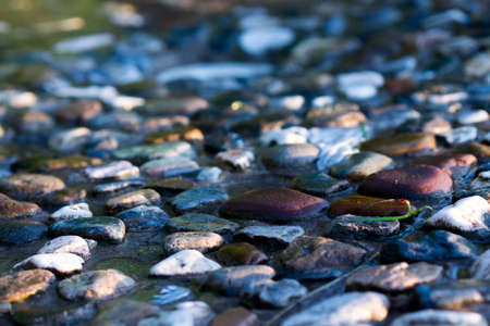 Closeup of old street gravel pavement textureの写真素材