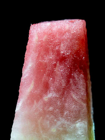 slice of watermelon on a black backgroundの写真素材