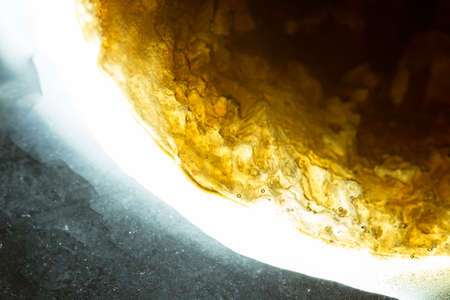 Cola ice crystal turns a beautiful brown backgroundの写真素材