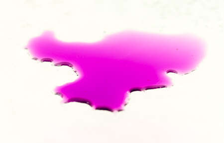 Water drops on glass on pink background