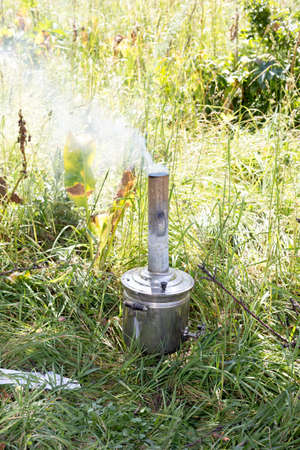 The samovar standing in a clearing in the smoke.の写真素材