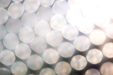 silver and white bokeh lights defocused. abstract backgroundの写真素材