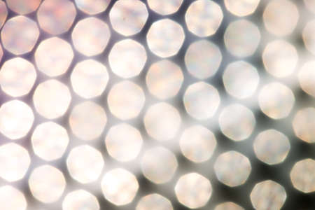 silver and white bokeh lights defocused. abstract backgroundの写真素材