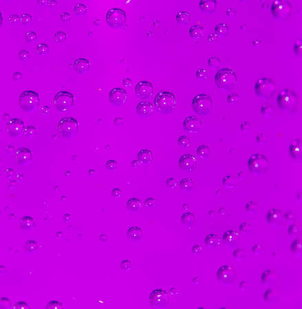 purple bubbles in water close-up abstract backgroundの写真素材