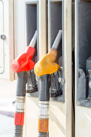 Filling gun at gas stationの写真素材