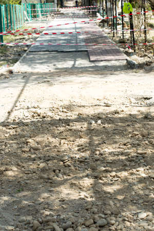the curb, sidewalk, gravel, repair roads, repair of the surrounding groundsの写真素材