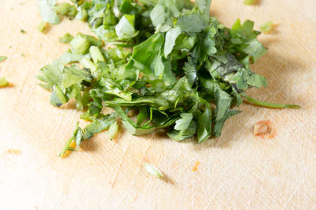 chopped herbs on cutting boardの写真素材