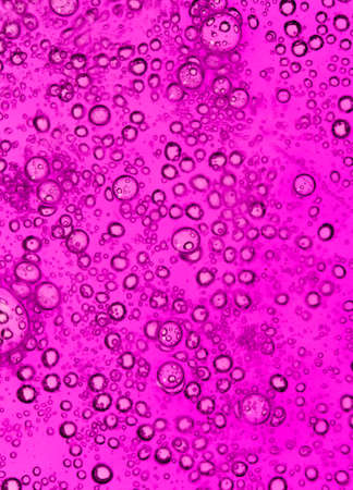 purple bubbles in water close-up abstract backgroundの写真素材