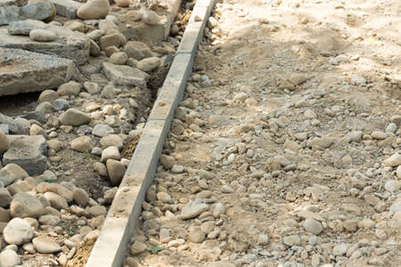 the curb, sidewalk, gravel, repair roads, repair of the surrounding groundsの写真素材