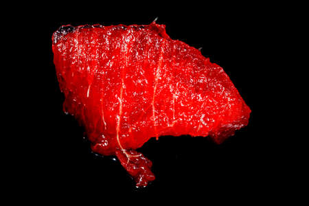 slice of watermelon on a black backgroundの写真素材