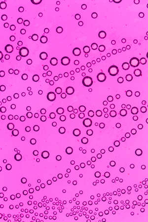 purple bubbles in water close-up abstract backgroundの写真素材
