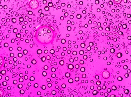 purple bubbles in water close-up abstract backgroundの写真素材