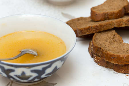 Soup with meatballs in a white bowl on the wooden background.の写真素材