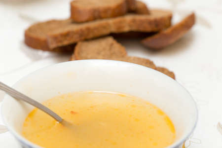 Soup with meatballs in a white bowl on the wooden background.の写真素材